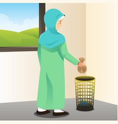 Muslim Woman Throwing Away Trash