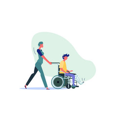 Nurse Pushing Wheelchair With Young Man