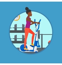 Woman Exercising On Elliptical Trainer