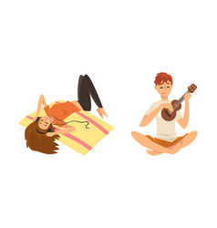 Man Playing Ukulele And Woman Lying On Carpet