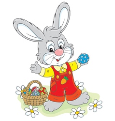 Easter Bunny with a basket of eggs Royalty Free Vector Image