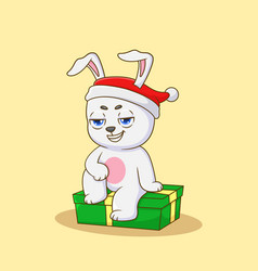 Cute Rabbit Sitting On A Christmas Gift