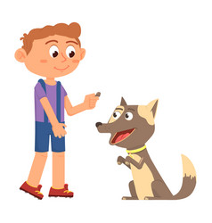 Boy Giving Treat To Puppy Dog Training Pet