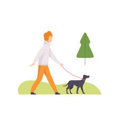 Young Man Walking With His Dog In Park Girl