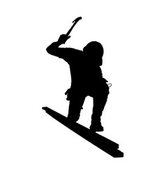 Silhouette Of A Builder On The Roof With A Hammer