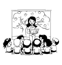 Teacher Reading A Book To Children In The