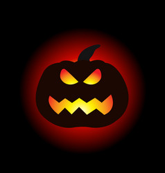 A Lit Halloween Pumpkin On The Dark Background