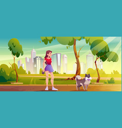 Young Woman With Dog Walking In Public City Park