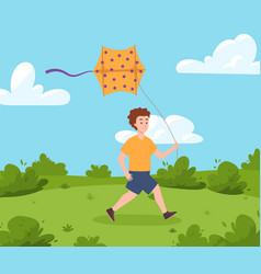 Teenage Boy Running With A Kite In Meadow