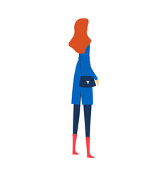 Redheaded Woman Stands In Blue Coat And Boots