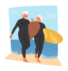 Older Couple In Wetsuits Enjoys The Beach Smiling