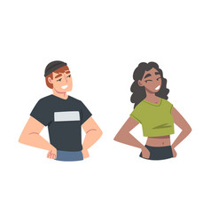 Confident Young Man And Woman Standing With Hands