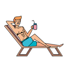 Young Man Relaxing In Beach Chair Drinking Juice