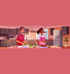 Man And Woman Cooking In Kitchen