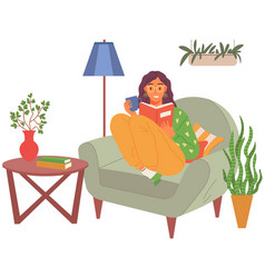 Young Woman Reading Book Sitting On Sofa Leisure