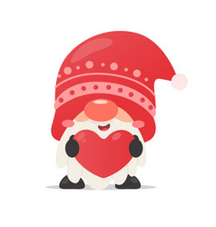 A Gnome Wearing Christmas Hat Holding Red