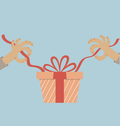 A Pair Of Human Hands Unwrapping Present