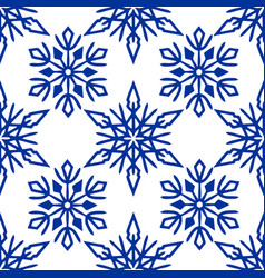 Seamless Pattern Of Blue Snowflakes On A White