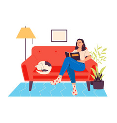 Woman Read Books Sitting On Sofa With Cat