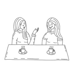 Two Girls Are Talking In Cafe Over A Cup Of Tea