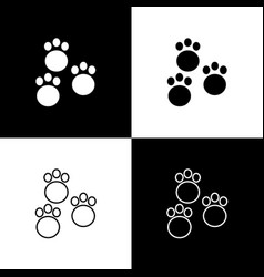 Set Paw Print Icon Isolated On Black And White