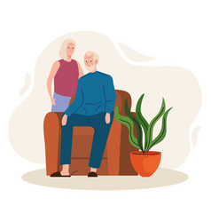 Elderly Old Couple Seated In Livingroom