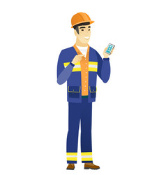 Asian Builder Holding A Mobile Phone