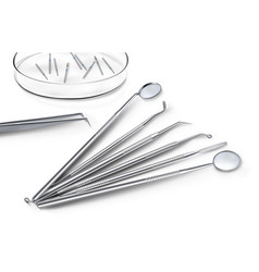 Dentist Stainless Steel Tools On White Surface