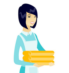 Young Asian Housekeeping Maid With Stack Of Linen