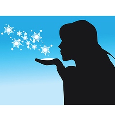 Silhouette Of Woman Blowing Snow