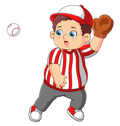 A Boy Dressed In Baseball Gear Catching Ball