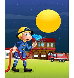 A Fireman Holding Hose