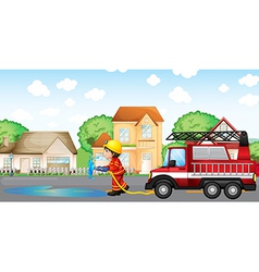 A Fireman Holding Hose With Fire Truck