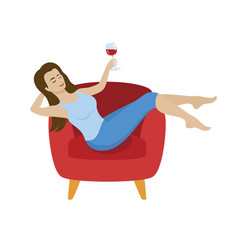 Woman Relaxing In An Armchair And Drinking Wine