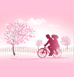 Couple Riding A Bike In Park