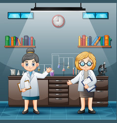 Two Female Scientist In White Lab Coats In A Labor