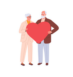 Senior Love Couple Holding Large Heart In Hands