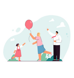 Happy Family Playing With Balloon Outside Together