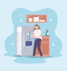 Woman Cleaning A Fridge