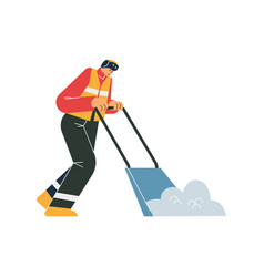 Janitor In Uniform Removing Snow With A Shovel