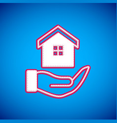 White House In Hand Icon Isolated On Blue