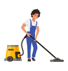 Male Cleaner In Overalls With Vacuum Cleaning