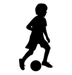 Silhouette Of Football Player Boy Kicking Ball