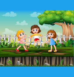 Three Girls Playing Jump Rope In The Park