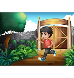 A Boy With Red Shirt Running Inside The Fence