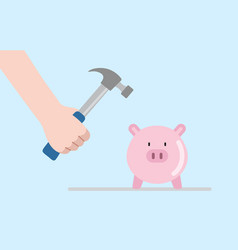 Hand Holding Hammer In Front Of Piggy Bank