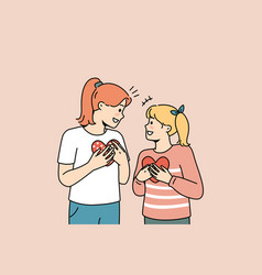 Smiling Girls With Paper Hearts In Hands