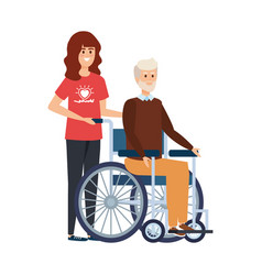 Young Woman Volunteer With Old Man In Wheelchair