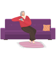 Adult Woman Sitting On Couch At Home Drinking