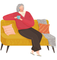 Adult Woman Sitting On Couch At Home Drinking